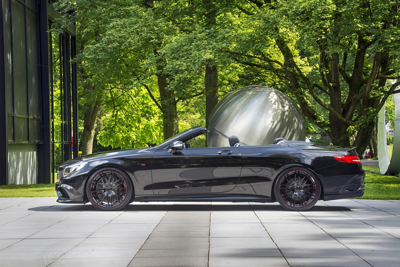 The S63 will seat four, and keep them isolated from the elements - even when the roof is down