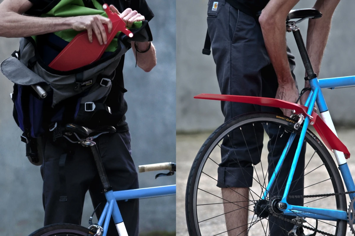 The QuickFix mudguard attaches to a bike in seconds, and packs flat when not in use