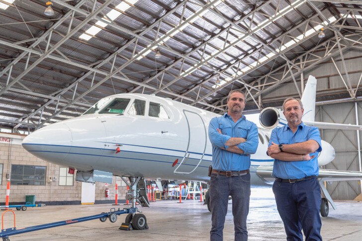 Aviation H2 directors, brothers Christof (left) and Helmut Mayer, with the kind of Falcon 50 business jet they hope to have flying on ammonia by mid-2023