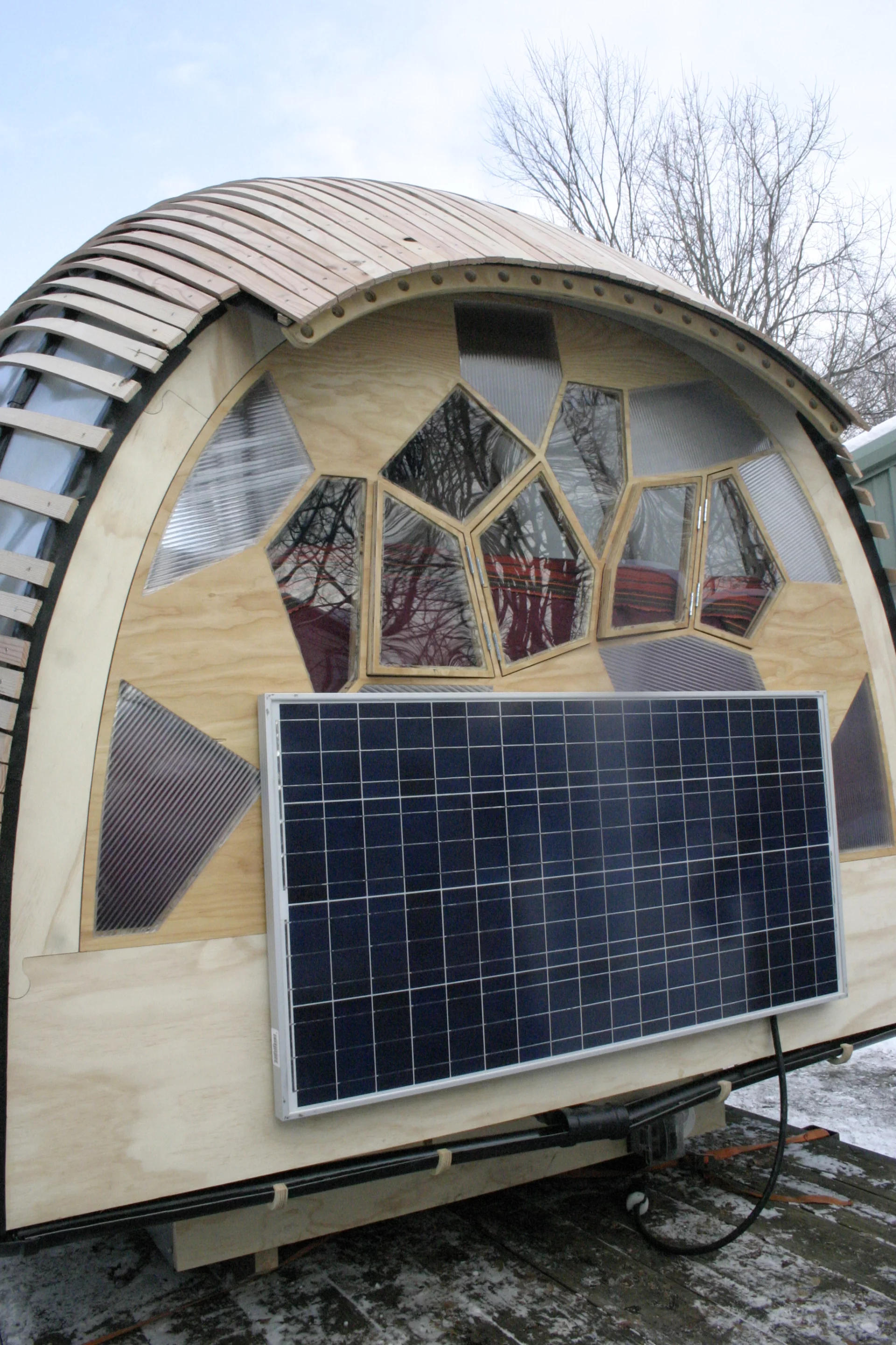 A 120 W solar panel is affixed to the front of the dwelling and provides all electricity needs