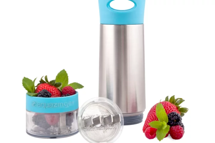 The individual components of Aqua Zinger laid out, including the berry and herb ingredients
