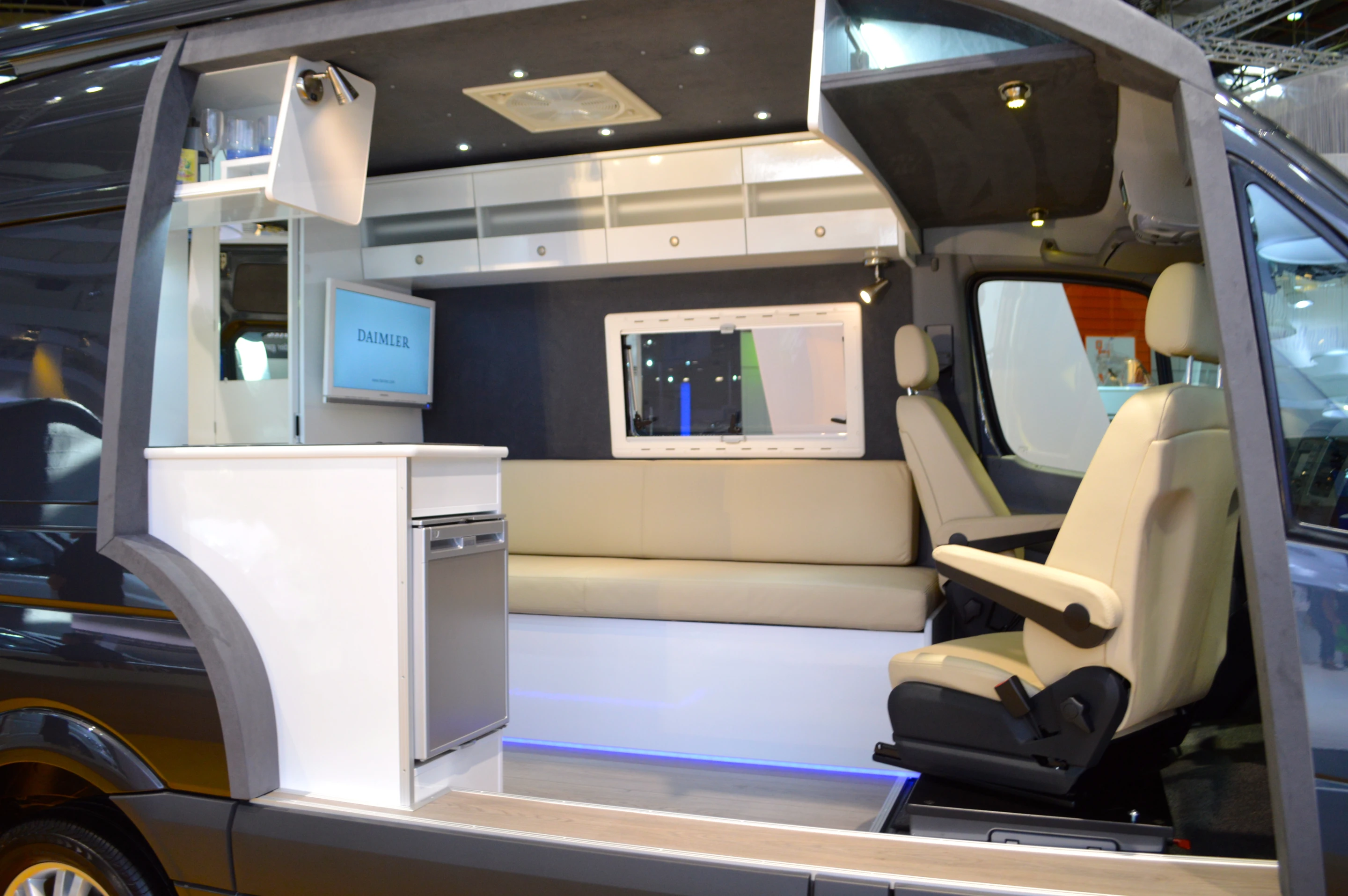 The interior includes white leather and Alcantara trim