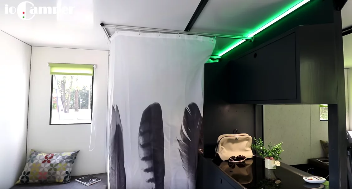 A look at that breezy bathroom curtain in the living area, right next to the kitchen, makes us wonder if ioCamper wouldn't be better off putting bunk beds in one room and using some of the extra space for a dedicated, hard-walled bathroom – or even relying on an outdoor bathroom
