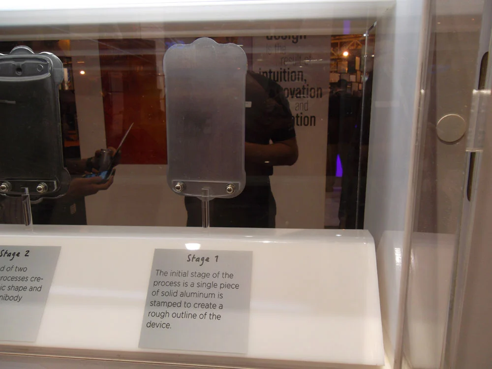 A piece of aluminum is stamped in the rough shape of the HTC One S (Photo: Enid Burns / Gizmag)