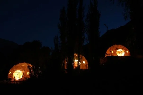 The hotel hosts a series of geodesic domes with elevated loft beds and open rooftops