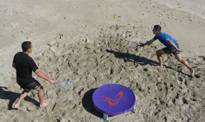 In the new racquet game of 360ball, players hit a ball into a central concave dish, trying to rebound it out of the reach of their opponents