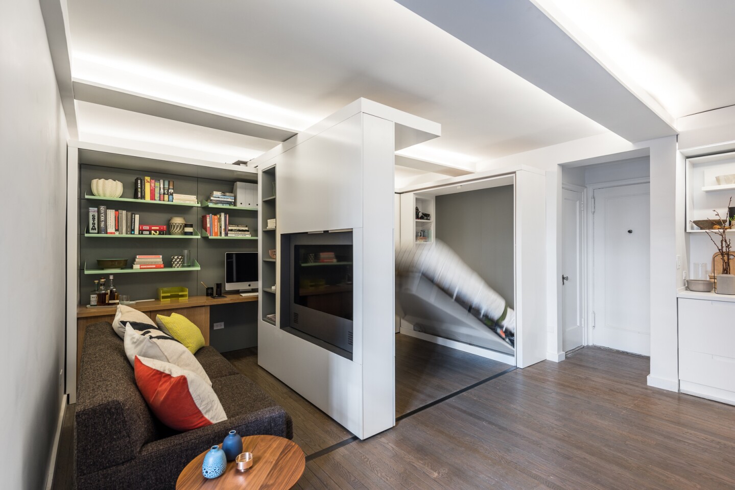 Once the motorized wall unit in the 5:1 Apartment has slid out, a bed can fold out from the previously hidden wall (Photo: Alan Tansey)