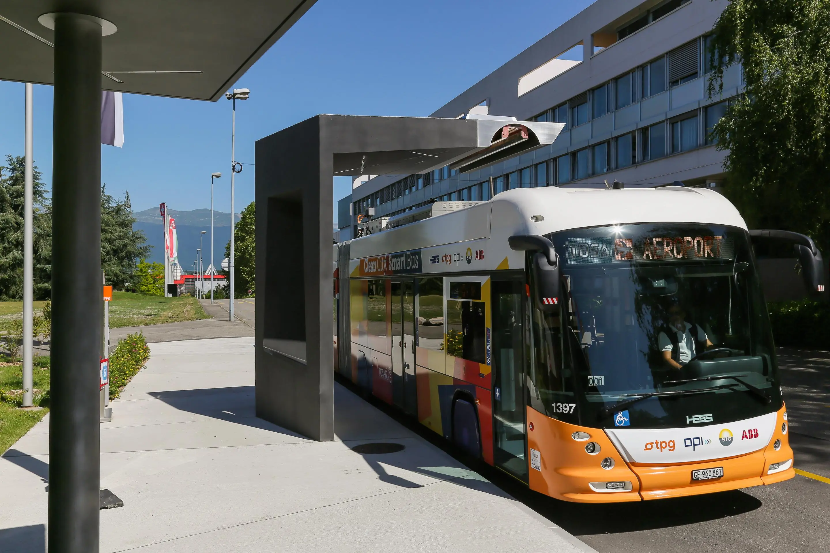 The TOSA buses charge as they stand at a bus stop