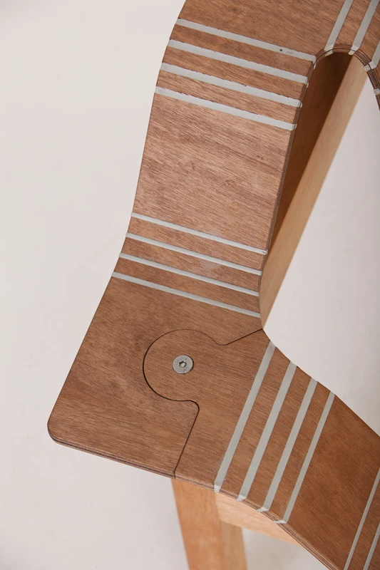 The plywood is scored and the gaps filled with flexible polymer, meaning the wood can be bent and shaped as needed