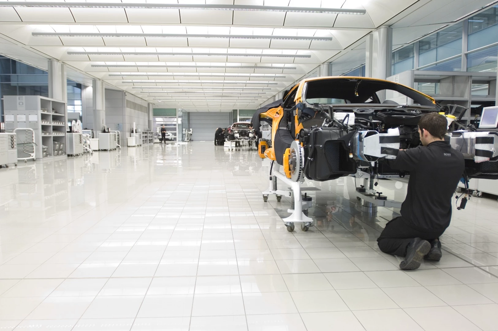 Cars start as carbon tubs, but make their way across the factory floor