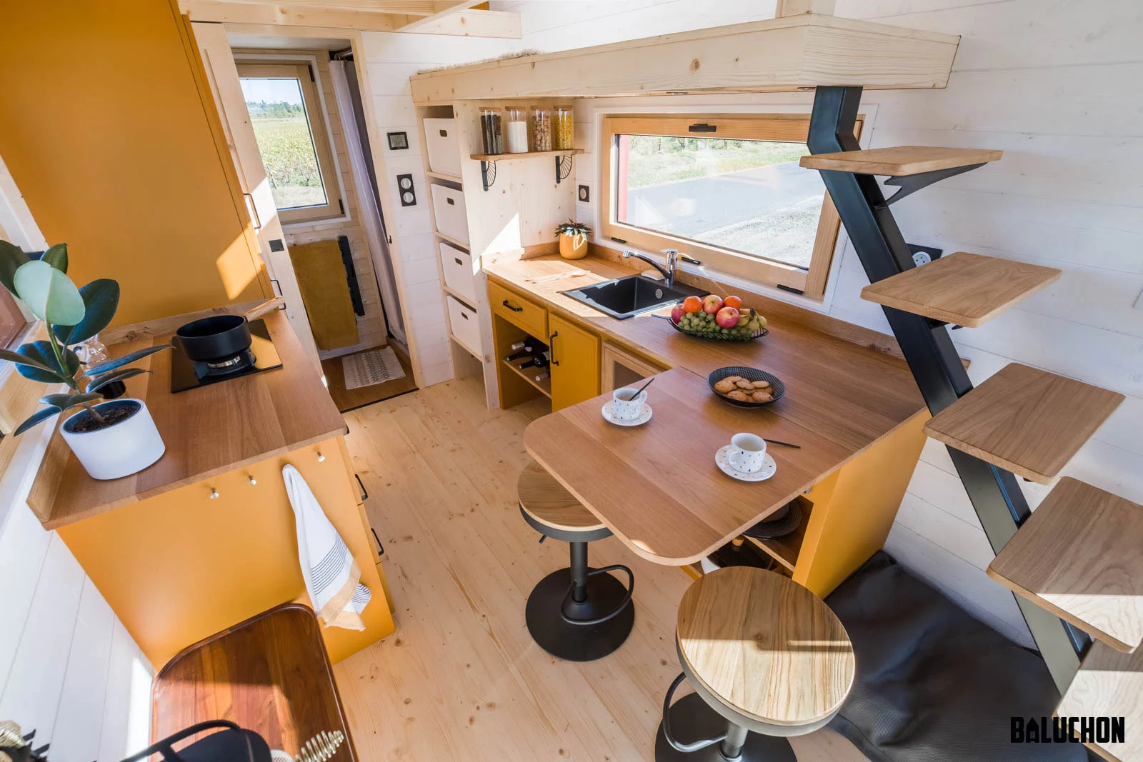 The Golden Hour's kitchen includes a drop-down dining table for two
