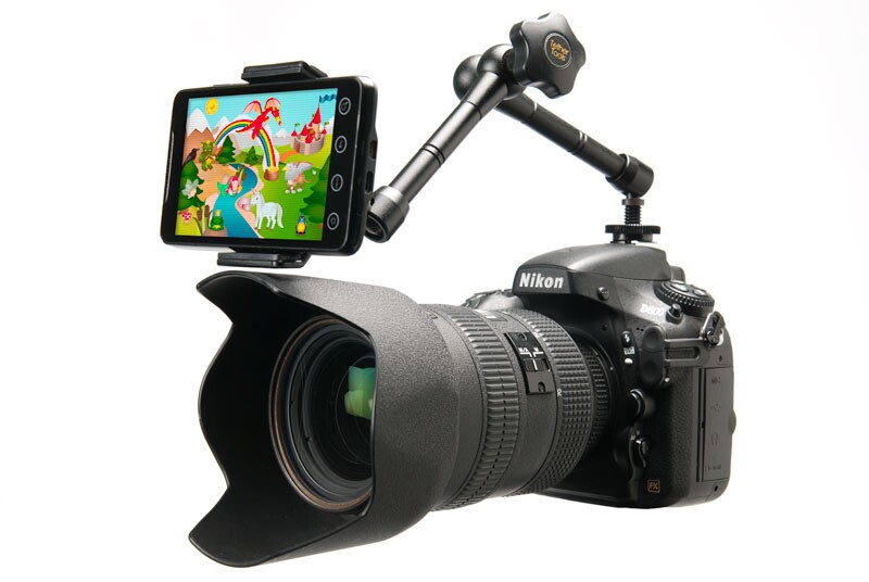 Playing a favorite cartoon or photographs of their friends and family will keep kids looking at the Look Lock ... and therefore the camera