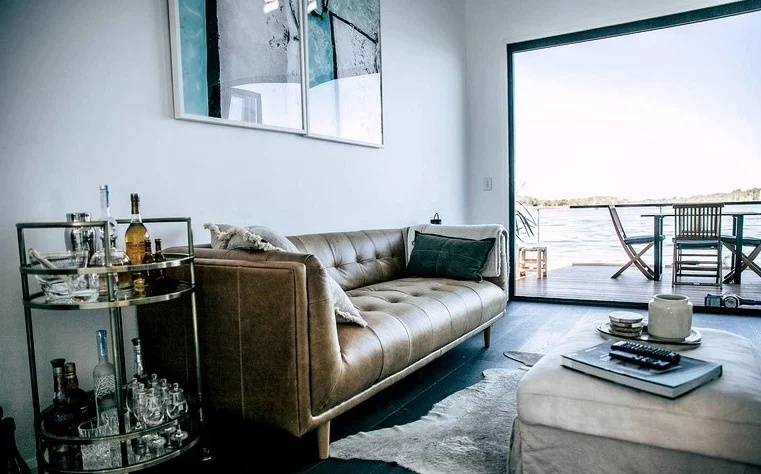 Large lounge area with leather sofa and flat screen television