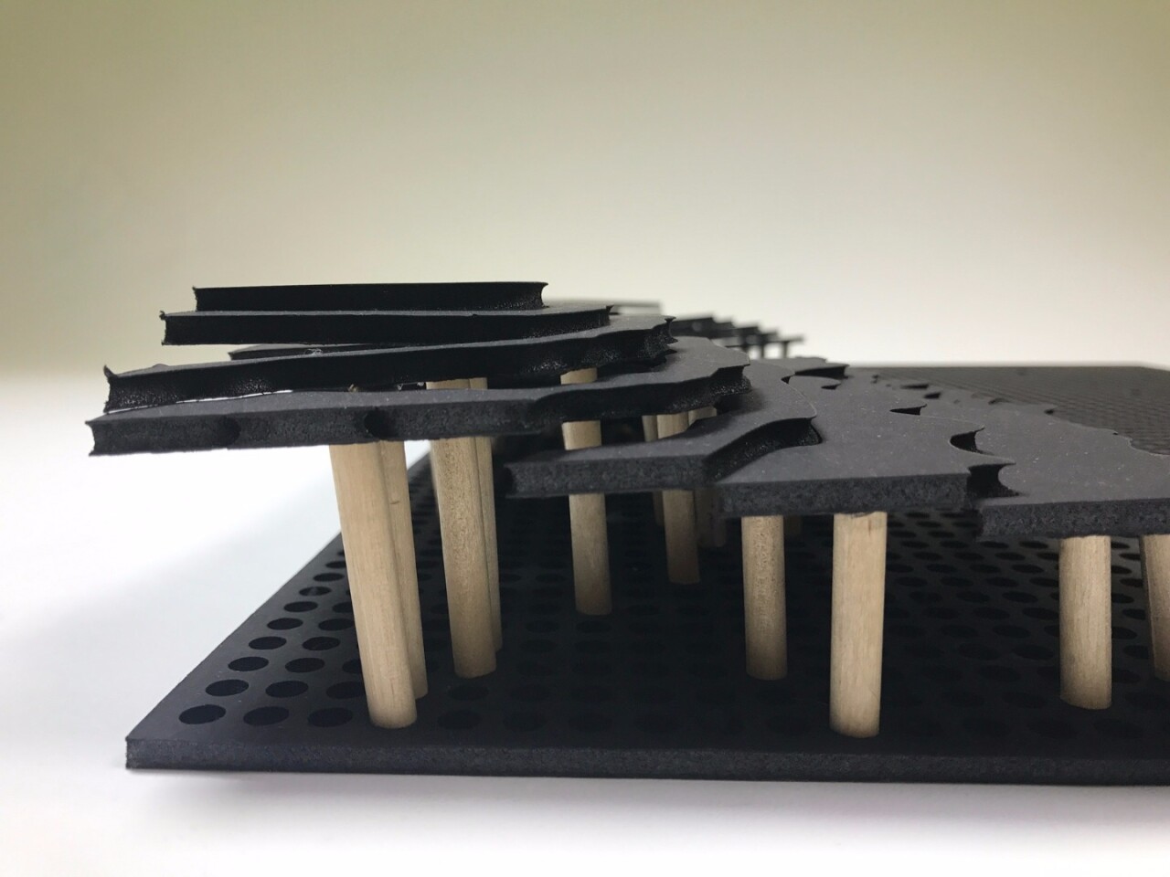 The map sections sit atop wooden dowels