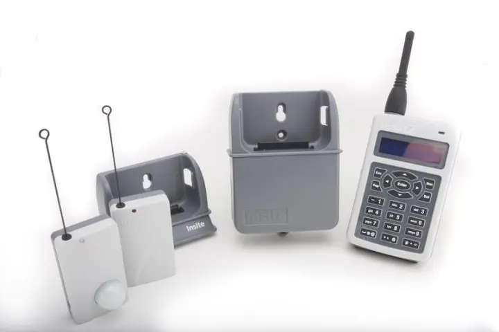 The Insite PGAMS i2 base unit, docking station, and wireless transmitters