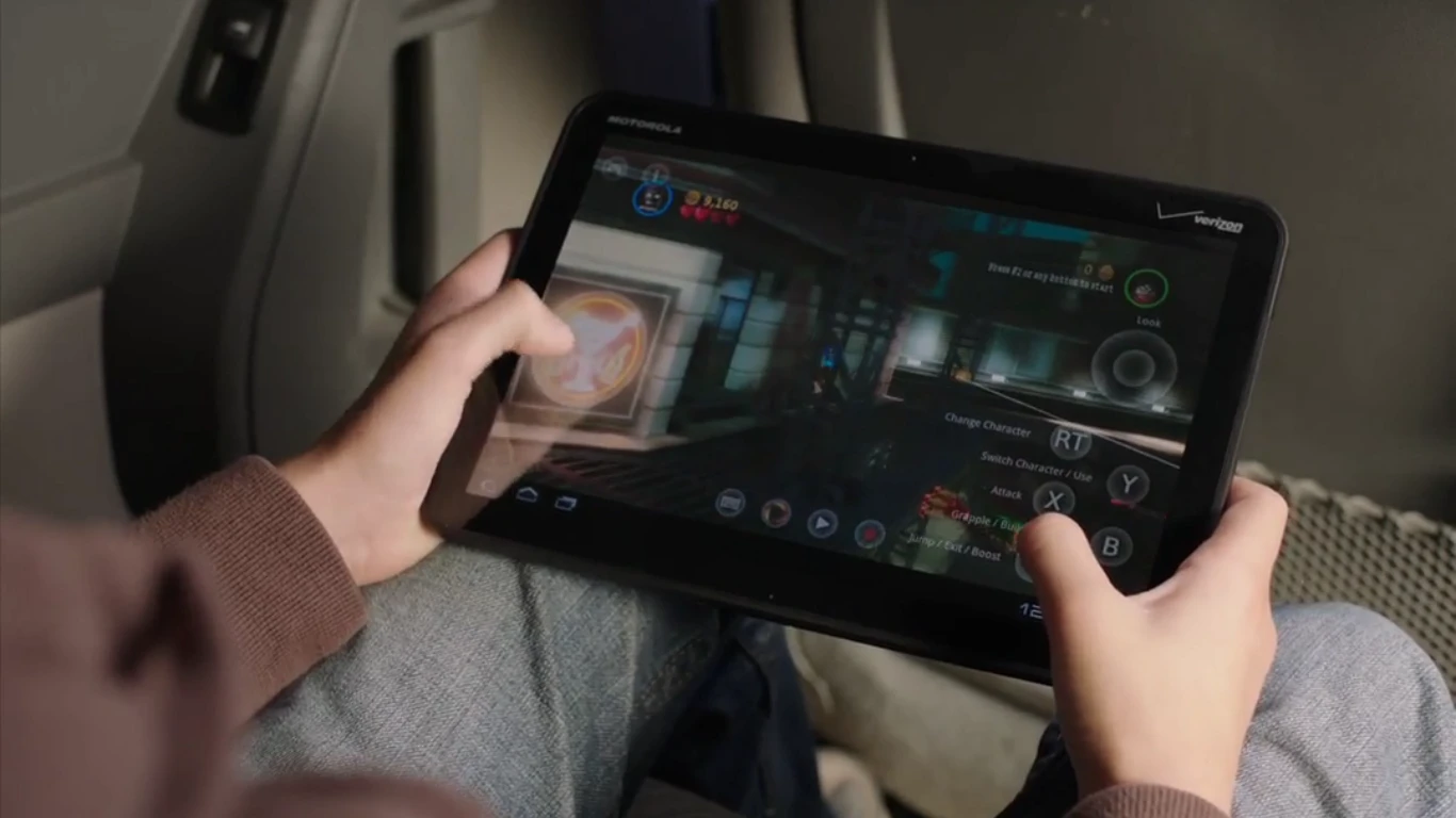 OnLive player control the action using on-screen touch controls or with OnLive's wireless controller