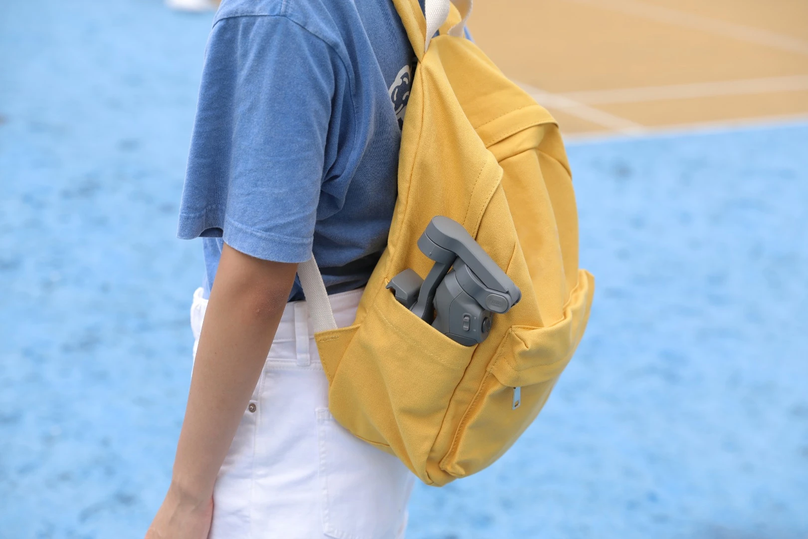 The DJI Osmo Mobile 3 can be folded down for transport in a backpack