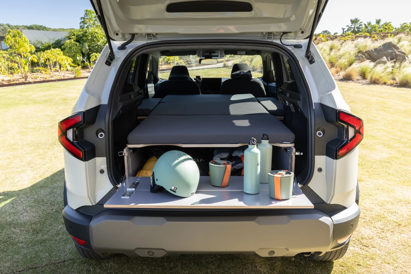 A simple fold-down table for preparing and storing food, beverages and gear