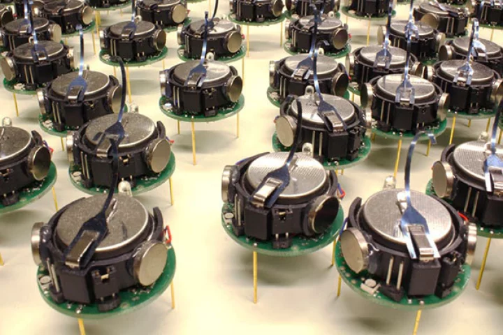Just a few of the Kilobots that were part of the swarm