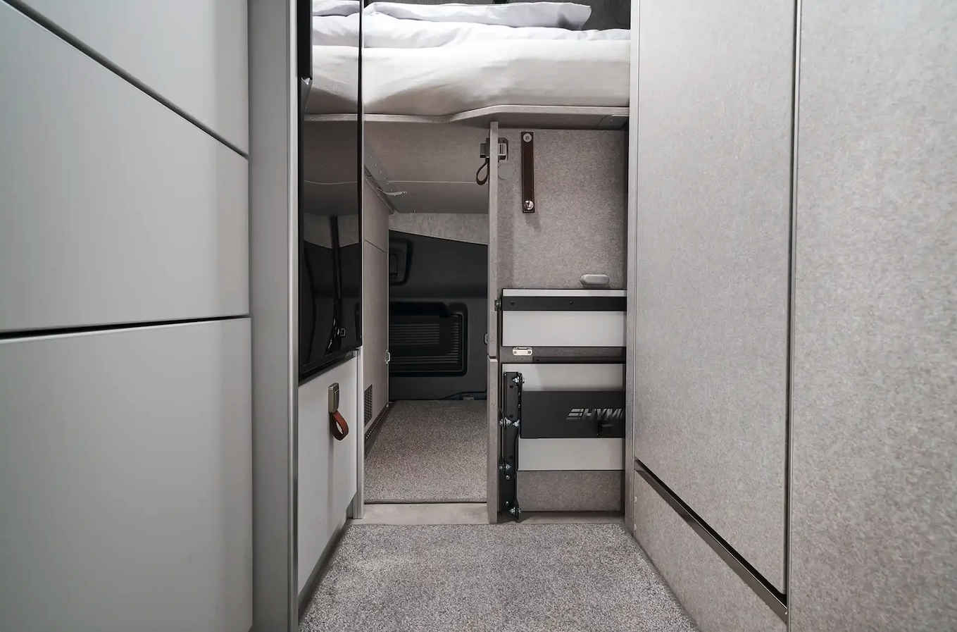 Under-bed pass-through door to garage