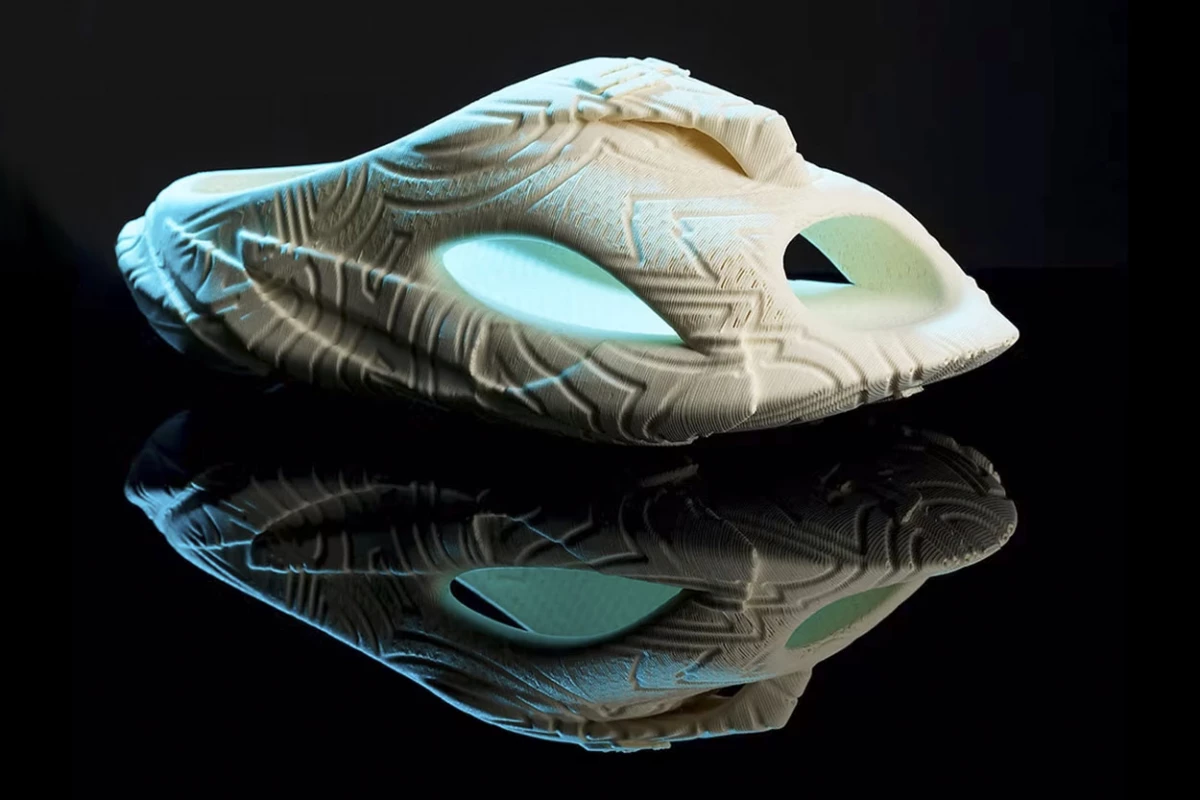 The Syntilay AI-generated, 3D printed shoe in beige gives off a real alien-appeal with this lighting. And though the photo looks blurry, I assure you, it's not: It's because of the 3D printed edges