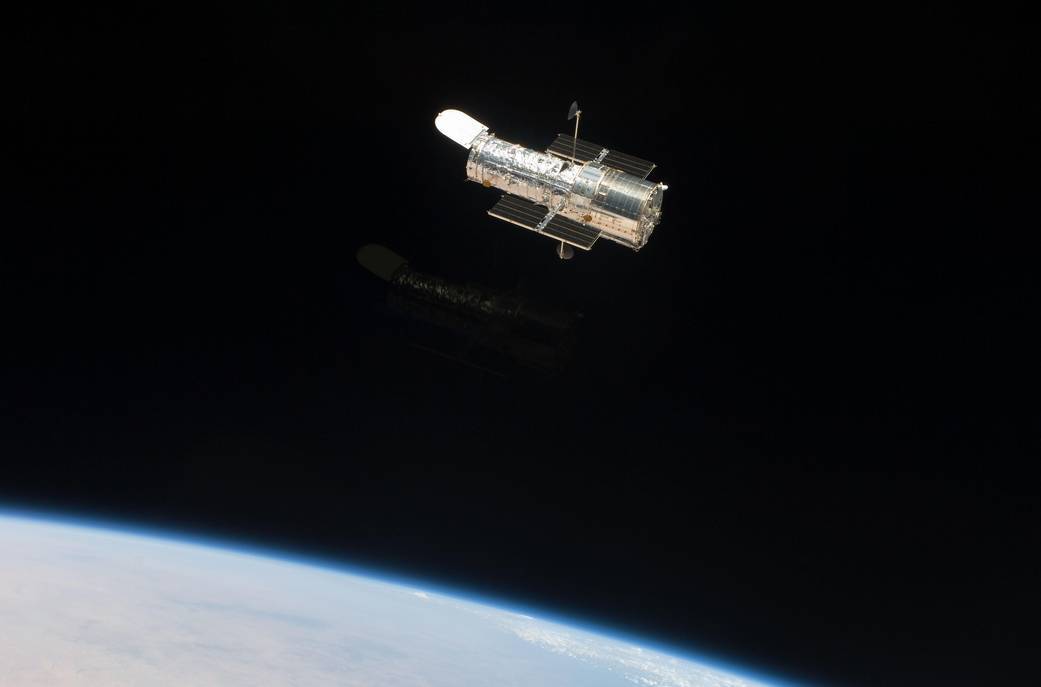 WASP-107b was observed by the Hubble Space Telescope, pictured above by the crew of the shuttle Atlantis during its final servicing mission