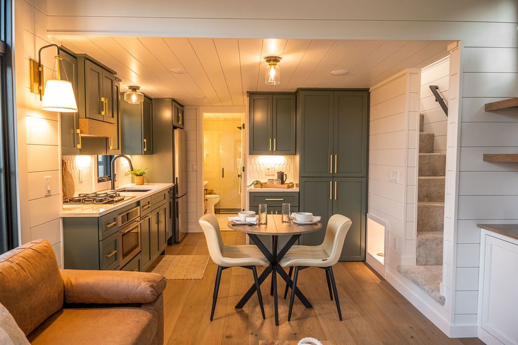 The Hidden Mountain Tiny Villa's kitchen includes a small dining table