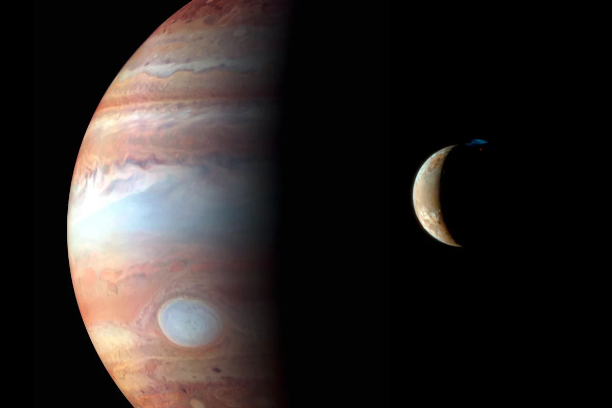 Jupiter and her volcanic moon, Io (Image: NASA/JHU/APL)