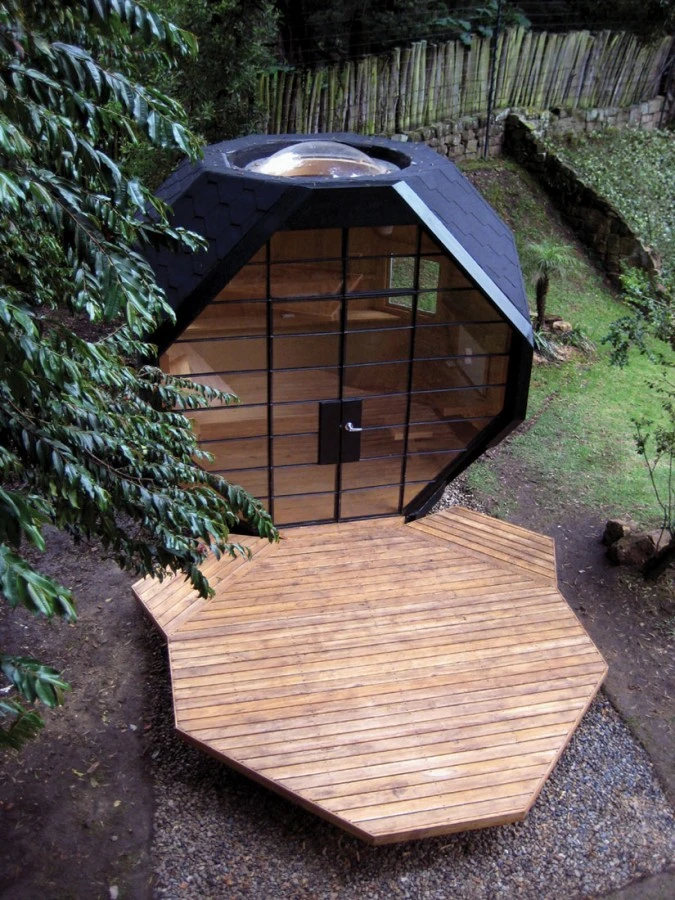 The front deck appears as it has peeled away from the main structure, giving rise to the pod’s large open frontage