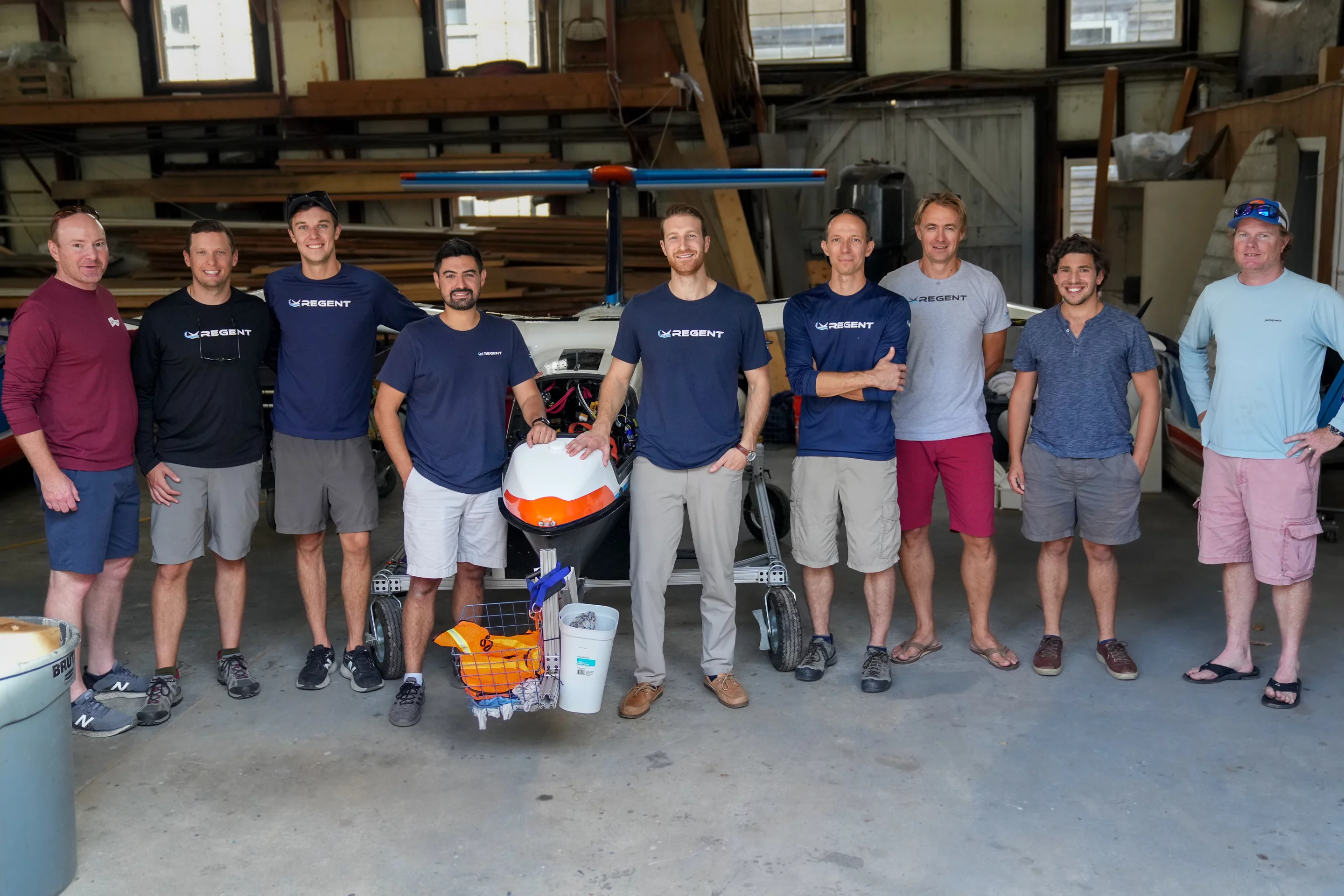 Members of the Regent team with the 18-foot prototype