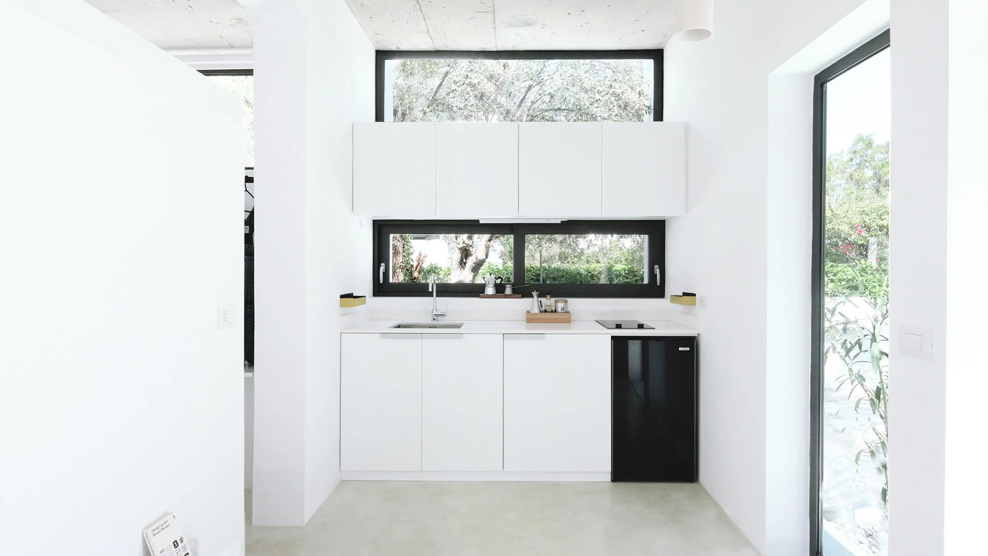 The Monocabin features a combined living and dining area with European wall kitchen