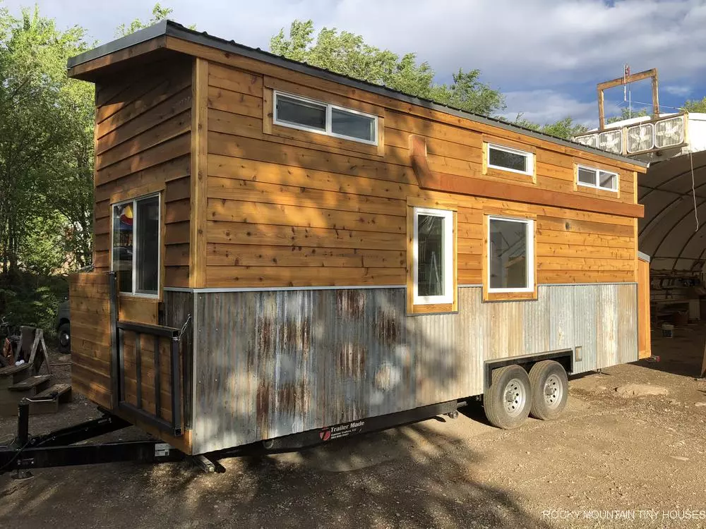 The Ad Astra is finished in cedar lap siding, with recycled corrugated metal accenting