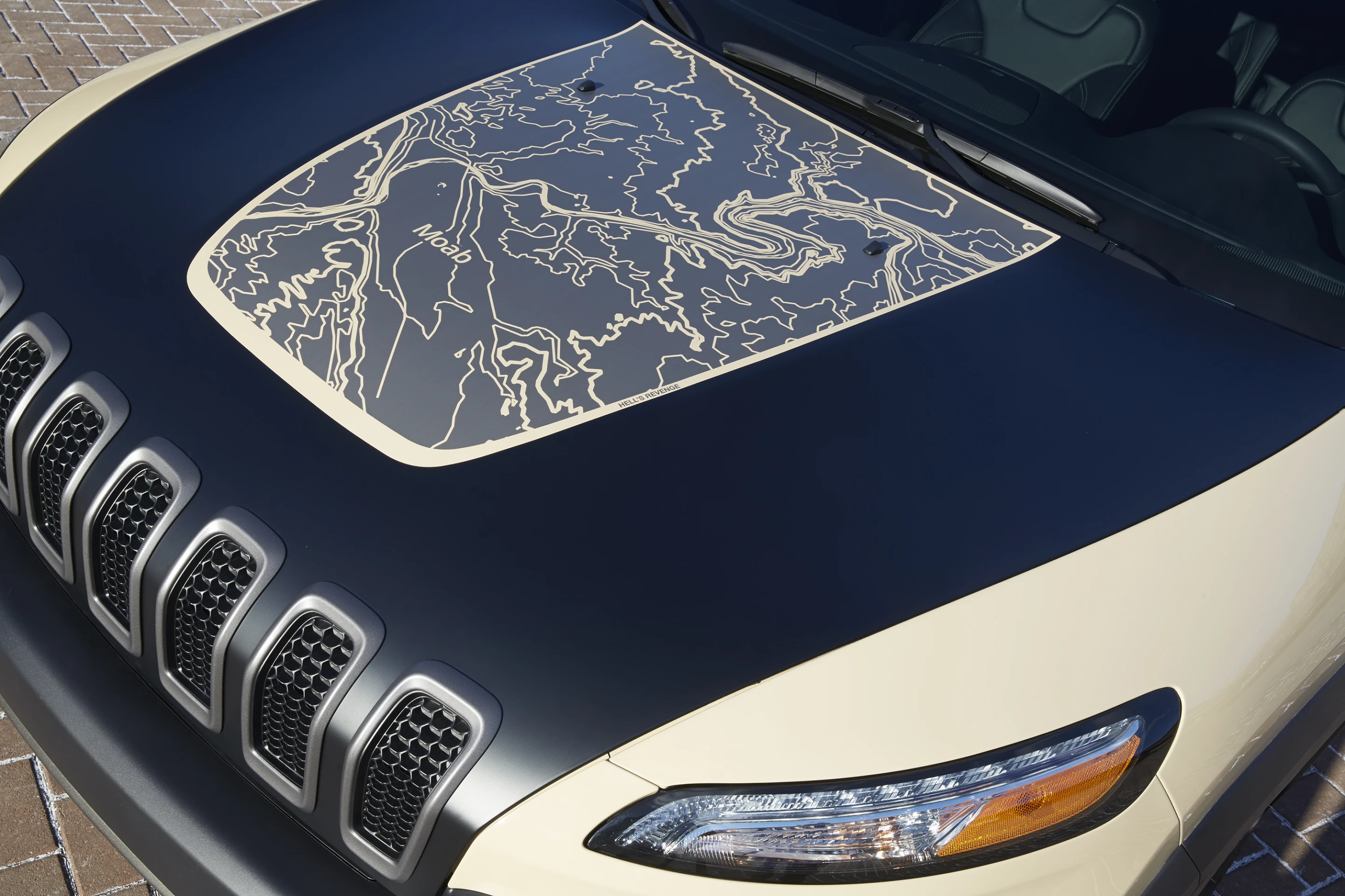 The Cherokee Canyon Trail has a topographic hood panel depicting Moab's Hell's Revenge
