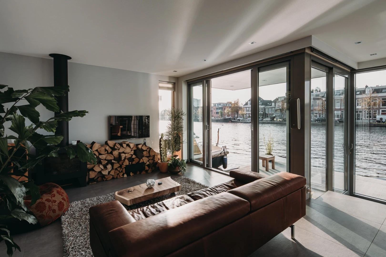 The Haarlem Shuffle features a large open plan living area with wooden fireplace