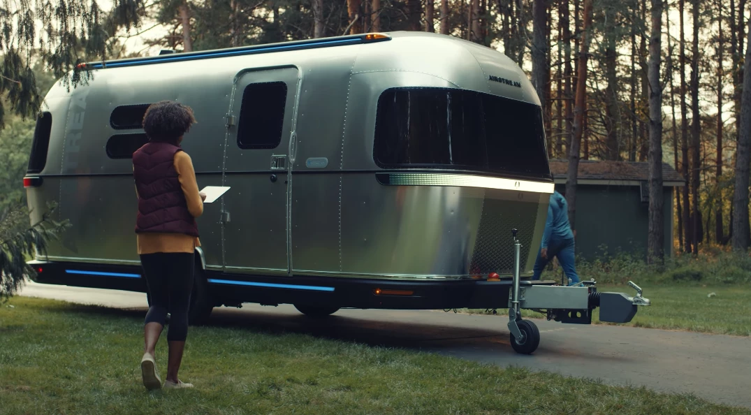 Instead of backing the trailer up, simply unhitch and maneuver it in via app