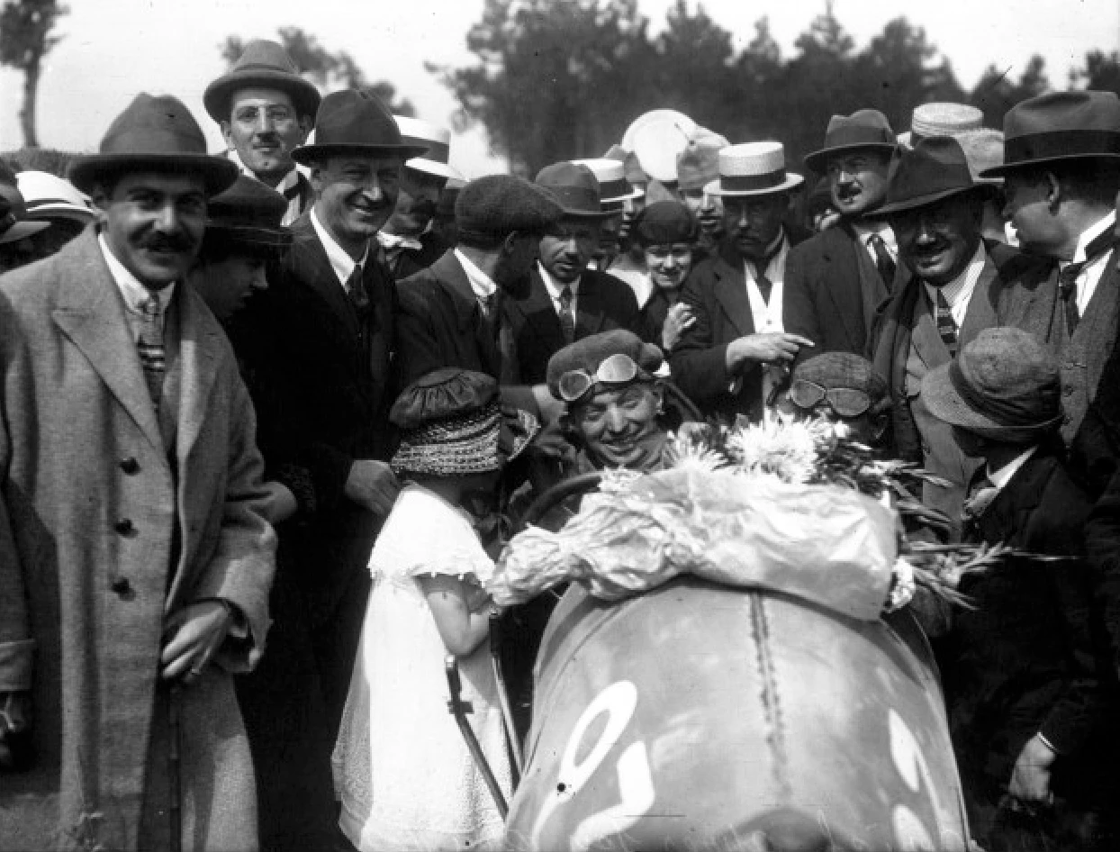 Ernest Friedrich (with winner's garland) after the 1920 "VIII Coupe des Voiturettes"