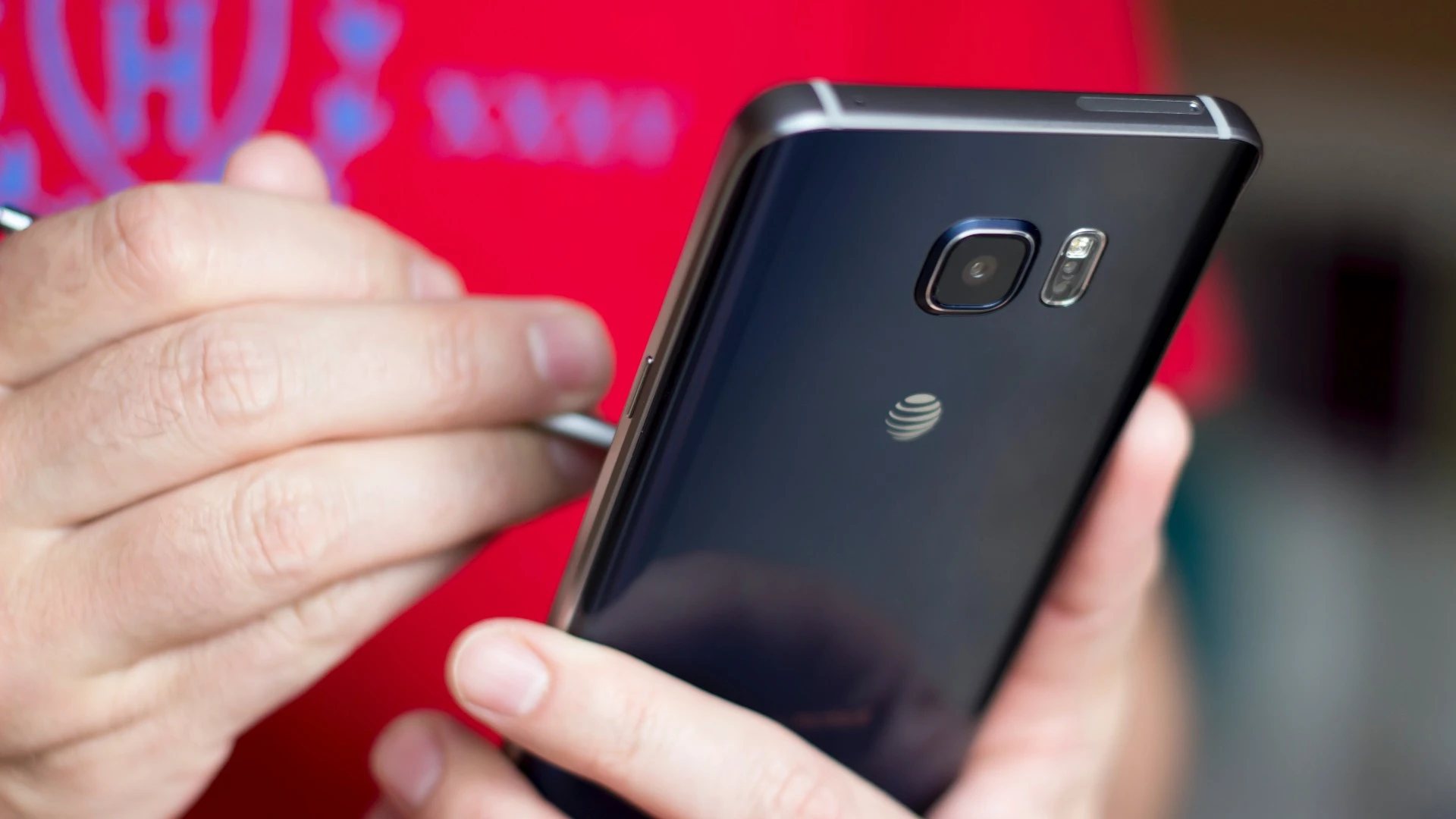 Unfortunately the AT&T variant has a logo emblazoned on the backside (we also have a T-Mobile version, and it only has Samsung branding)