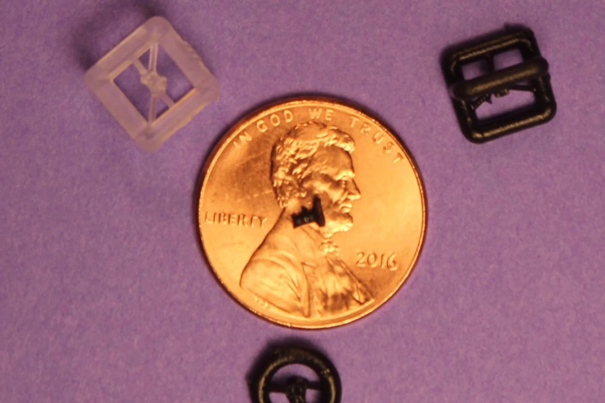 One of the 3D-printed prostheses, placed on a penny for scale