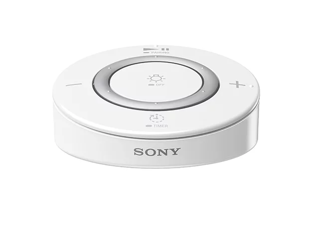 The remote control for Sony's new LSPX-100E26J LED light bulb speaker allows users to adjust the volume and brightness of the bulb and control a sleep function