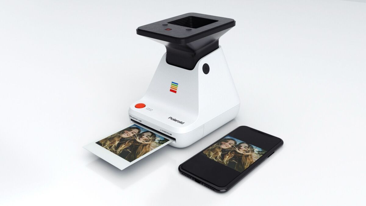 Placing a smartphone on top of the cradle and pushing the red button results in an instant photo being printed