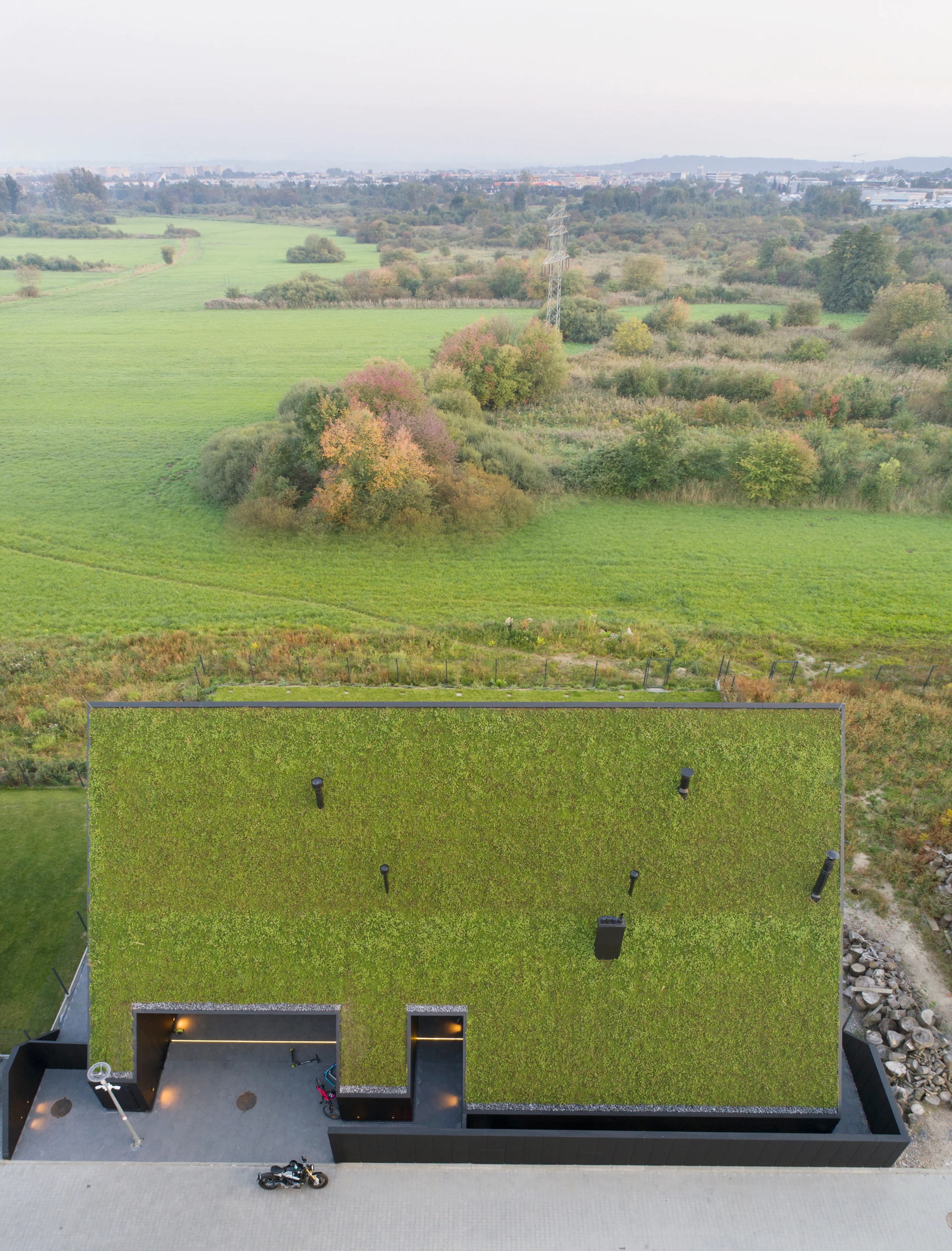 House behind the Roof has some sustainable features, including a green roof and solar panels