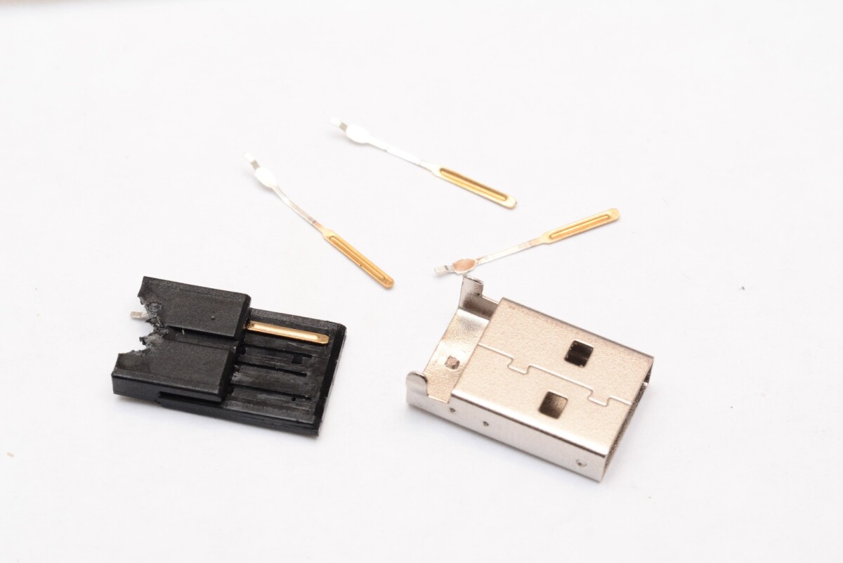 The pins were cut back and the electronics installed into a scraped out cavity in the black plastic frame