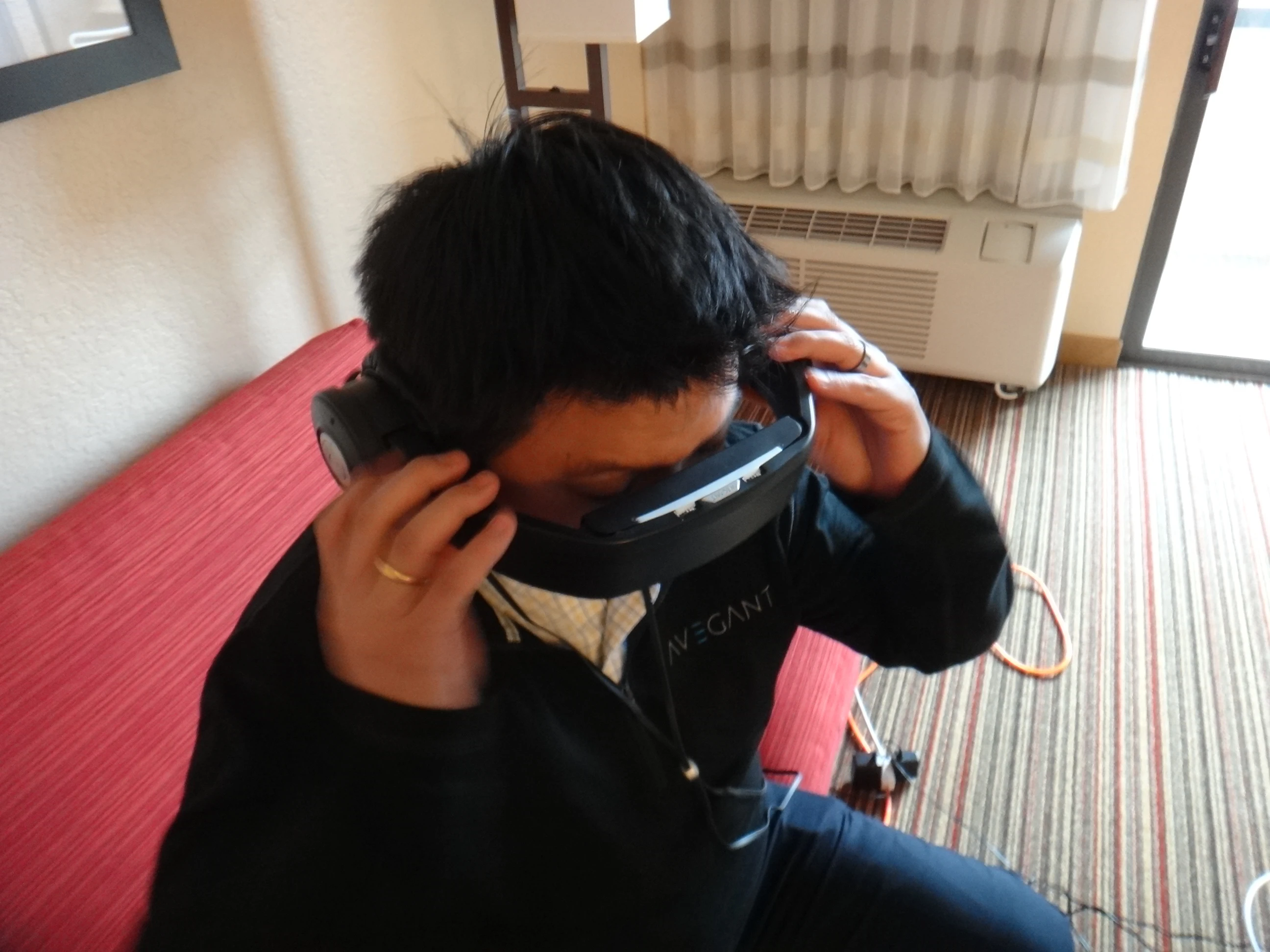 Since the alpha prototype of the Glyph is still quite fragile, Tang put the headband/visor down for me before fitting it over my head