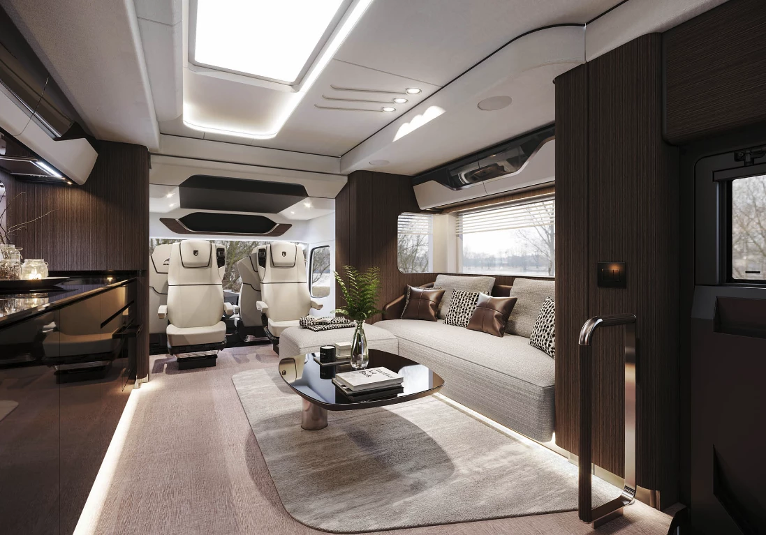 The living area includes a queen-size bed over the driver-cab seats