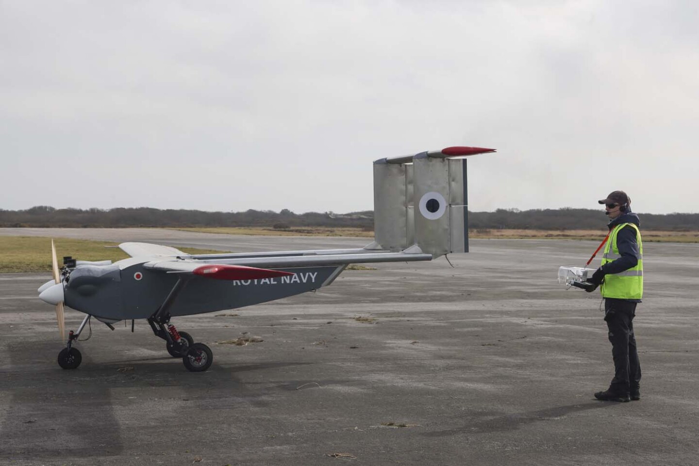 A UAV operator prepares the UAV for launch at Predannack Airfield during flight tests