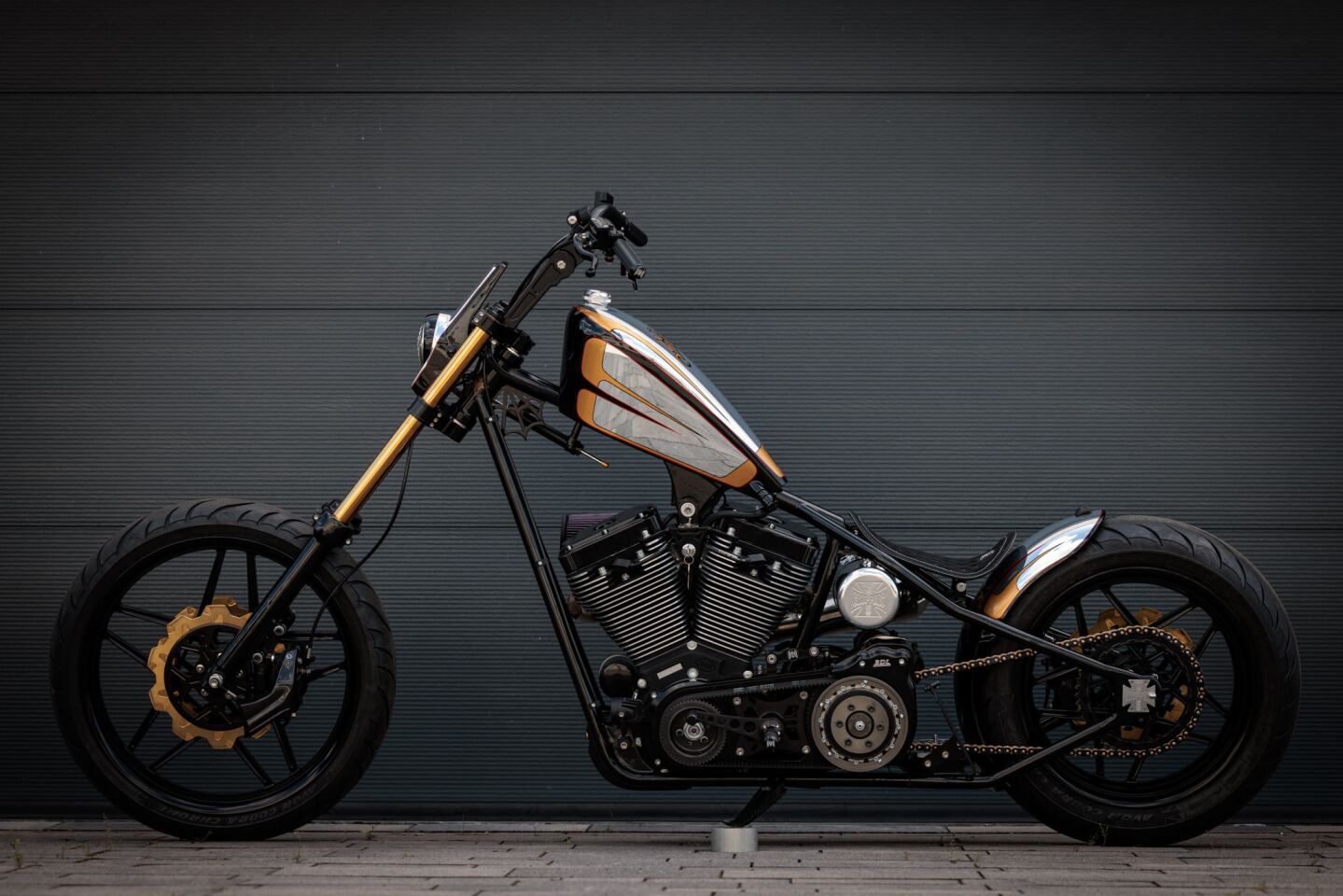 The chopper sports a TIG-welded hardtail frame with a raked-out front end and a unique skeleton