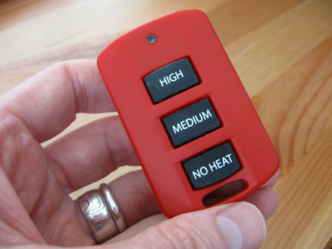 A simple push-button wireless remote lets users switch between High, Medium, and No Heat settings