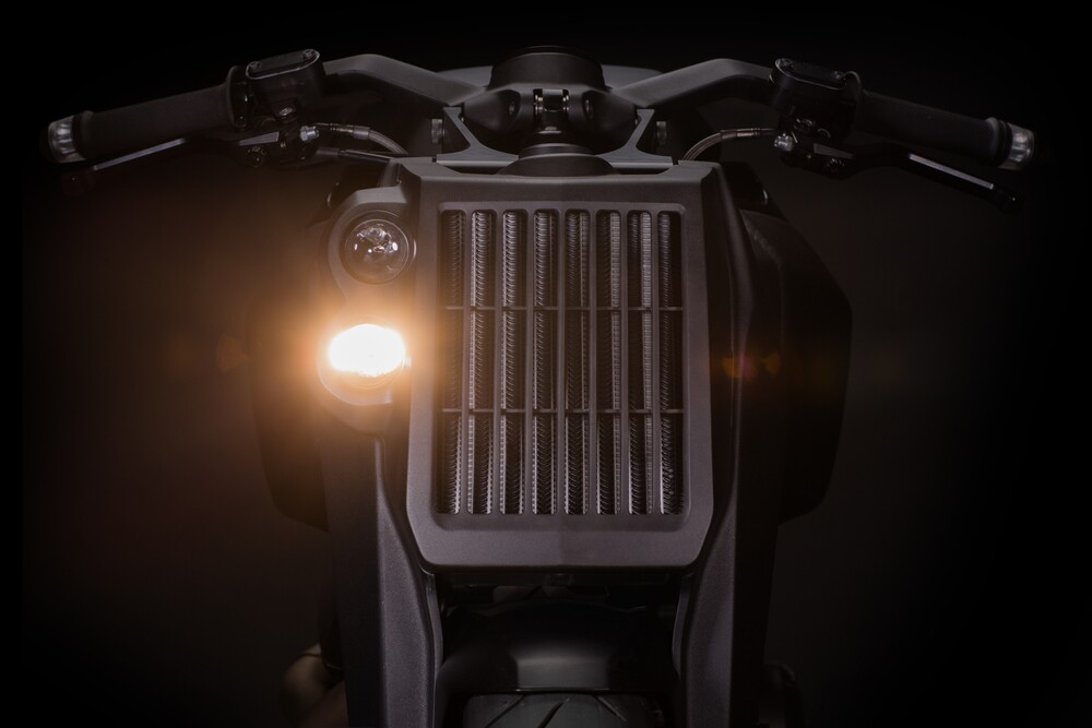 The Ronin's imposing radiator face, with projector beam headlights