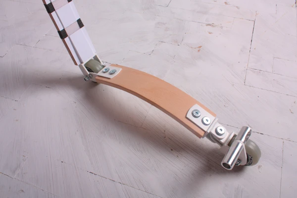The Belt Scooter features curved wood strong enough to support a person's weight but light enough to wear as a belt