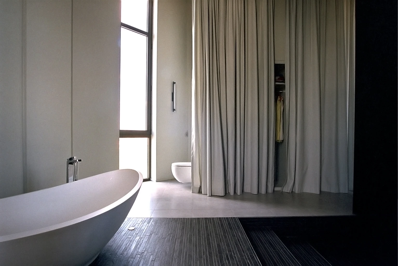 The main bathroom, with a 4.5 meter (14.8 ft) high shower as its dramatic centerpiece, takes up the entirety of level three (Photo: Bham)